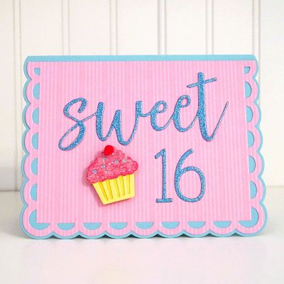 Sweet Sixteen Birthday
I used the cupcake from the Half A2 Gate Fold Card, put the chunky glitter (Sprinkles) on it, and topped it with a miniature pom pom for the cherry.  I also used the quirky number dies for the 16 in The Stamps of Life glitter paper. Card base is Small Scallop A2 Card Die Set.
Keywords: Sweet Statement, 16, Sixteen, Happy Birthday, cupcakes