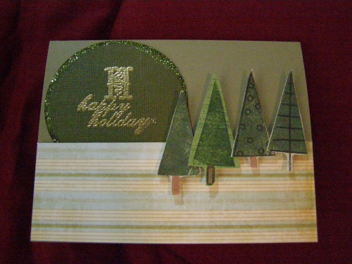 Happy Holidays card
I added some glitter around the circle that I cut with my Slice.  I pop dotted the trees off from the card. TFL
