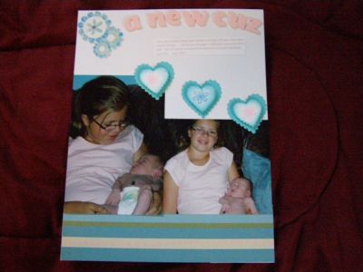 Scrapbook page for daughters album
It is hard to see but I used the dot outline in pink on the taupe stripe on the bottom of the page.  I stamped one of the flowers in the center of each white heart.
