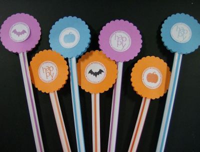 Pixie Stix
After consulting with another member of this community, MayAZ(my BFF no less), for ideas, this is what we came up with for a project I needed. I made these pixie stick toppers for my October crop girls using the Stamps of Life October set. They are double-sided, with each using the "happy" stamp on one side and an icon on the other. Whoever draws the stick with the black bat wins a prize :)
