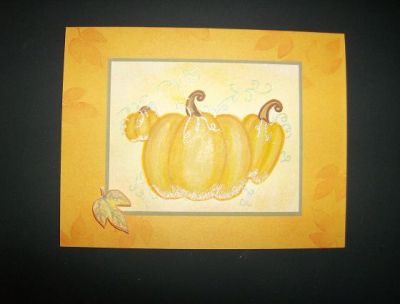 Fall Card TSOLC01
The orange card background was created by sponging orange & peach onto an orange background, overlayed with orange stamped leaf from the October stamp set. The pumpkins were stamped in peach on a peach & orange sponged piece of cardstock, then highlighted with assorted colored pencils and glitter (which doesn't show well). Same with the leaf stamp on pop dots. Green vines were hand-drawn and also highlighted in glitter. 
