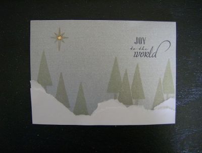 This is just not showing up well in photos as I used silver glimmer paper for the background and metallic inks for the images. The tree stamp and the "joy" are from the Stamps of Life. 
