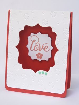 *Love die-cut card
I embossed the white layer on this card, and then diecut the center of the card, after adhering the embossed layer. The sentiment is attached to the inside, using foam tape.
