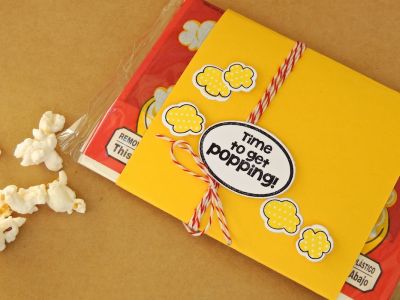 *Popcorn wrap
This is a quick way to dress up a bag of microwave popcorn. It could be a party favor, or party of a gift set, or even just a little pick-me-up for a coworker or friend. I just wrapped cardstock around the package and embellished it.
