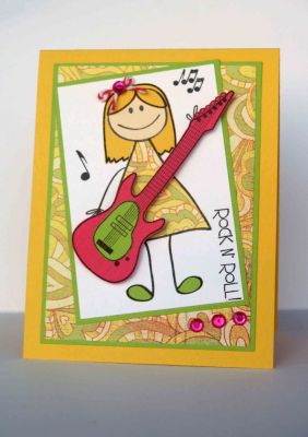 Rock N Roll girl
Eek, I must say I LOVE the way my rocker chick turned out! :)  I think the patterned paper is BasicGrey.  Cardstock is from Discount Cardstock. 
Keywords: guitars2play kids2love