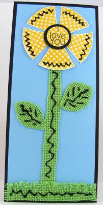 **Love You Flower Card**
Fast and FUN flower created using the polka dot spinner "filler" stamp in the morespinnerideas2stamp set.  Stem and stalk of flower are done with green
burlap by DCWV.  :)
Keywords: morespinnerideas2stamp