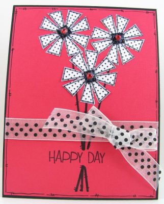 Happy Day Card
Stamped the daisy image on polka dot paper, drew the stems on the red cardstock for
a fast and easy card.  The centers are black chipboard I handcut into small squares and covered with sparkle Mod Podge.  Fun card.  :)
Keywords: crazy4daisies