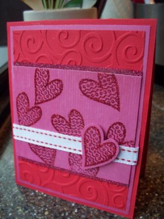 Valentine card
Here is a valentine card I made.  The paper is from The Paper Studio and ColorBok, CuttleBug swirls embossing folder, ribbon is from Stampin Up.
