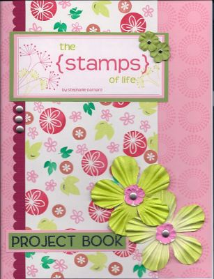 Project Notebook Cover TSOLC02 
8 1/2 x 11 Cover for my new Stamps of Life Project notebook.  I slid inside the cover of a purple 3 ring binder.  I used pink, dark pink, and green cardstock.  I also used the September and October stamp sets.  Pink sheet was stamped as a patterned paper look as well as the multi-colored sheet on white card stock.  The flowers are from Prima Marketing Inc., the letter stickers are from Making Memories.  The scalloped edge is from Stampin' Up, and the brads are Making Memories.  
Keywords: thanks2fall