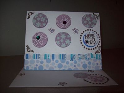 Happy Birthday
I stamped and punched out the circles and then place on pop dots to lift from card. Also put some rhinestones in areas of the card for sparkle.I used Ribbon and some pattern paper for the bottom. 
