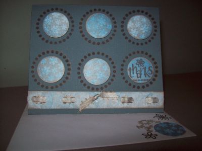 Thanks
Used the Back to Basics Sept. 09 Stamps. I used colored card stock and Ribbon. I punched holes in the little paper piece at the bottom . Then I stamped the ribbon so that it would match the card. Then I wove it through the holes. I used pop dots to lift off the page for the punched circles. I stamped the ring for the background. I used Blue and Gold ink to make the white card stock match the background.
 
