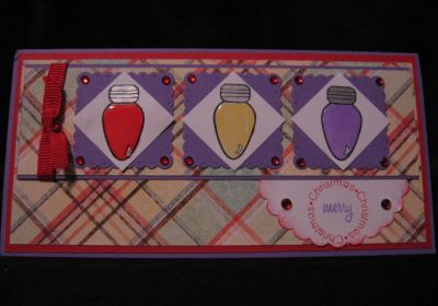 Merry Christmas
I just love this set! So many things that you can do with it!  I used my Jelly pen by Sakura in Silver for the screw part of the bulb and then I stamped the color into the bulb and added crystal effects. I also punched out square scallops and pierced all the way around the edges of the scallop squares and then added the red gems to the corners and onto the sentiment. I am working on more creations with this set so I  am excited to  share more with you all!
