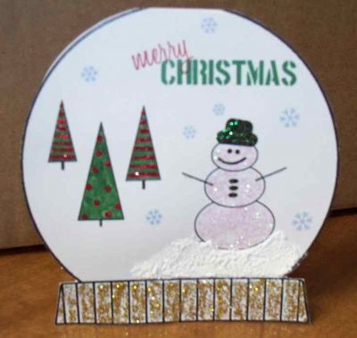 Cut It Out Snow Globe
All the images are digital stamps from the Nov 09 set printed as one layout onto the paper. Trees colored with marker due to software limitations and then glitter and snow added. More complete directions on blog.
Keywords: digital