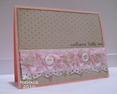 Welcome Little One...
My card base is pretty in pink.  I used my swiss dots CB folder on a kraft panel and then distressed and sponged brown ink over it.  I used my eyelet border punch on white CS and added some gathered gingham ribbon with button accents.

TFL!

http://emmielouwho.blogspot.com/
Keywords: sweet4babies vintage