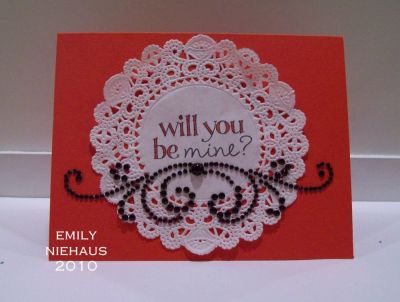Valentine doily...
Another CAS card with this fab set! I stamped the sentiment on a white doily and colored the letters with a red Copic marker.  I added some black rhinestone flourishes under the sentiment.  I like how it turned out, but my son says it looks like my card has a mustache!!!!  I guess it kind of does...oh well!

TFL!

http://emmielouwho.blogspot.com/
Keywords: hearts2love CAS Valentine