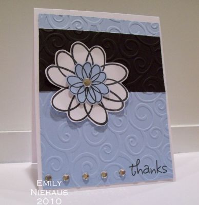 Flower thanks!
I made this card with the flower2doodle set.  I layered the large and medium flowers and then added a rhinestone in the middle.  I created three panels on my card front and ran them through my cuttle bug with the divine swirls folder.  I added a row of rhinestones next to my sentiment at the bottom.
Make sure that you stamp on your panel before you run it through any type of embossing folder!

TFL!

http://emmielouwho.blogspot.com/
Keywords: flower2doodle