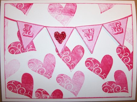 Love 2 My Valentine
Using stamps from Hearts2Love, stamped background with Tsukineko Rose Red Versa Mark Ink; stamped & cut out banner from Banners4All set; stamped LOVE from Hearts2Love on each banner;filled in heart with Red Stickles.
