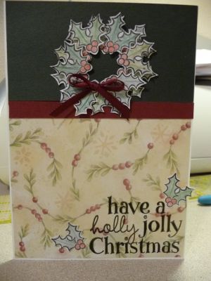 wreath card
I cut out the holly sections & put down the first row directly on the card stock. I added the second row with pop dots. 

