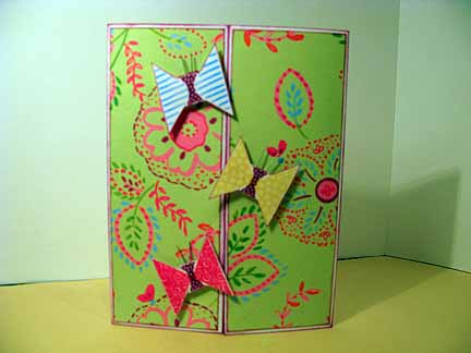 butterflies front
Ink all edges. Make a gate-fold card and cover the front with patterned paper. Use the small kite triangles stamped point to point to make butterfly wings. Stamp the kite bow in the middle for the butterfly body. Cut out and add wire antenna. Use pop-dots to mount on the front of card. 
Keywords: kites2fly, butterflies