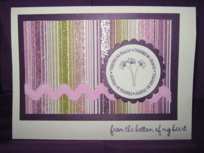 Thank you card in purple and pink
cream card stock layered with purple.
striped pattern paper with large rick rack in pink
stamped circle layered with purple scalloped punch
stamped sentiment at the bottom
Keywords: thank you