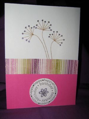happy birthday in pink
cream card stock stamped with saddle brown stayzon
pink cardstock layered with striped pattern paper
circle stamped with purple glitter pen accents and rhinstone in flower center
large flower stamp also accented with purple glitter pen
Keywords: happy birthday