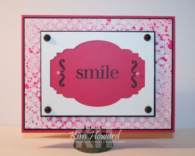**Smile
Card details:
Stamps:  Calm2keep and Dots2love from The {Stamps} of Life
Cardstock: Mauved by the Paprazzi, Basic Black, Gina K. Pure Luxury White
Inks: Color Box by Stephanie Barnard-Licorice, Stephanie Barnard Sprays-Bubblegum and Guava, Versamark
Embellishments: Majestic Labels from Sizzix for Stephanie Barnard, Stampin'Up! pearls, clear embossing powder
Keywords: calm2keep dots2love
