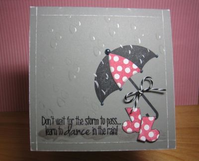 Dancin' in...pink polka-dot boots!
Gotta love that polka-dot panel for the umbrella! Boots were stamped and cut out by hand. Puddle made with Smooch ink; bow on umbrella from The Twinery.
