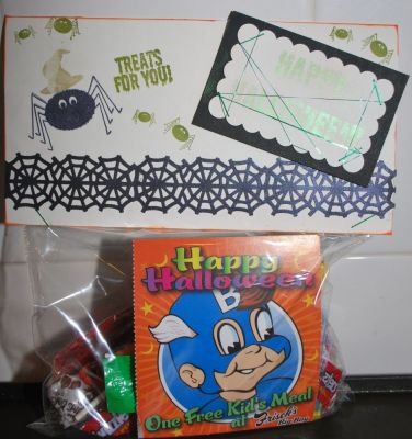 Halloween Treat Bag
For my niece and nephew this year...  stamped "Happy Halloween" and the hat with perfect pearls medium and brushed on the green perfect pearl.  Martha Stewart web punched paper in black brushed with purple perfect pearls.  Happy Halloween 'tag' wrapped with green silky thread.  
