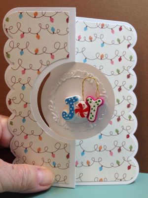 Loved adding a tiny removable ornament to the front of this card. Cut out a small frame and embossed it to encircle the ornament.
