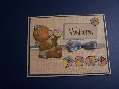 Welcome Baby
I used the ice cubes for blocks.  I masked the exclamation point on the "Welcome" from houses4us. The bear was cut from Debbie Mumm Nursery Rhyme paper, an old stack I have had for years.
