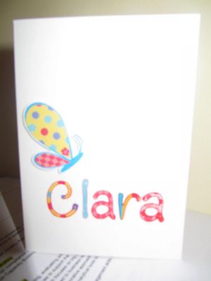 The photo is poor, but the butterfly wings are paper-pieced and it's adhered with pop-dots to give some dimension. 

