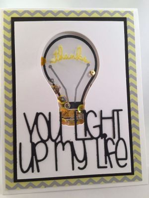 You Light Up My Life
Cardstock:  The Stamps of Life
Pattern Paper:  The Stamps of Life*
Stamps:  lightbulb2stamp from The Stamps of Life
Dies:  Light Bulb dies from The Stamps of Life
Ink:  The Stamps of Life, Tsukineko Encore Silver, Avery Elle Pigment, Ranger Clear Embossing Powder
Other:  Sequins and beads from Pretty Pink Posh and Judikens Window Sheet

Keywords: Shaker lightbulb2stamp Light Bulb Stamps