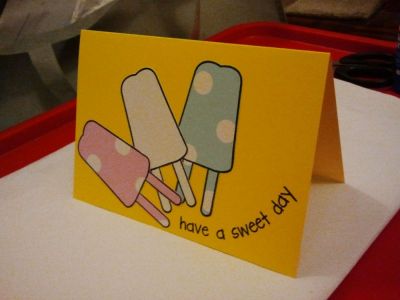 have a sweet day
Two Popsicle stamped on pattern paper, one Popsicle stamped on white paper using black chalk ink.  Cut all three and stick on to yellow cardstock.  Arranged the sentiment in a curve and stamp with chalk ink. 
Keywords: pops2eat, popsicle