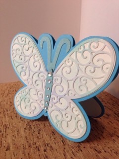 Pretty Butterfly
Sizzix adhesive is a must for this intricate butterfly. I sponged and added some glitter.
