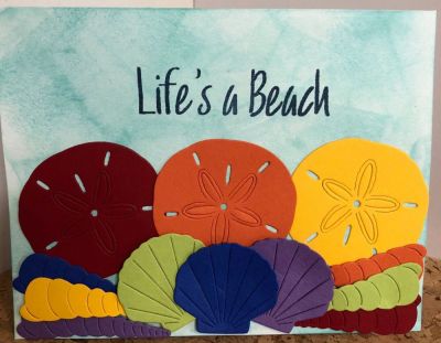 Life’s A Beach
I sponged the background with ocean ink. I die cut the shells in rainbow colors. Super quick card. 
