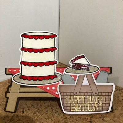 Picnic Birthday 
I used picnic table fold it. I decorated with an embossed cake from cake2biuld stamp and die set. Die cut picnic basket from July club kit paper. I die cut two glasses from words4toast dies. Embossed Happy Birthday message on basket. 
