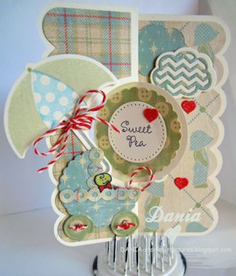 The baby carriage was made with SOL Dies.  The body of the carriage I used the medium scallop dies from the Circle Flip #2, the trim is found include with Circle Flip it#4 and for the wheels I used the Mini Button Dies. 
