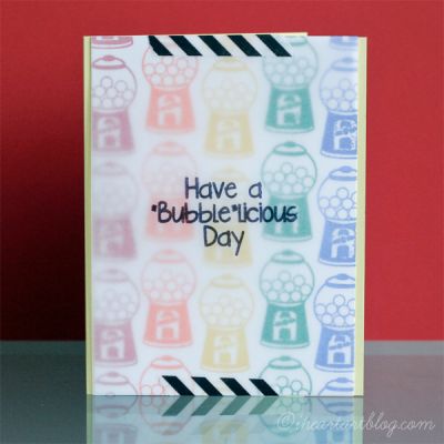 Bubblelicious Rainbow Card
Here's a fun rainbow card I created by stamping the small gumball machine multiple times in rainbow colors. Then, I added a vellum sentiment panel to the front!
