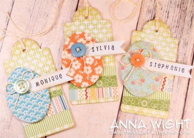 Pretty Eggs: TAGS
I used the egg die that coordinates w/ the large eggs of the Eggs2Hunt set to create tags. Used Back2Squares to stamp on the base of the tag. Buttons and name banners dress them up.
Keywords: Eggs2Hunt Back2squares