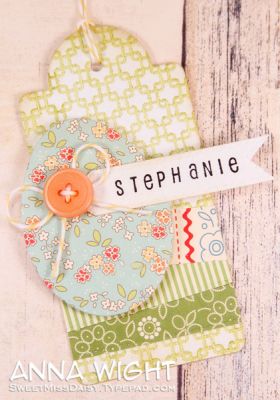 Egg Tag
I used the egg die that coordinates w/ the large eggs of the Eggs2Hunt set to create tags. Used Back2Squares to stamp on the base of the tag. Buttons and name banners dress them up.
Keywords: Eggs2Hunt back2squares