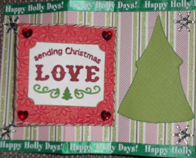 Penquin Christmas card inside
I used the square flip it die. I cut out an extra square section of red and ran it through a poinsettia embossing folder. The "Sending Christmas Love"  is from a Sizzix embossing folder, then trimmed and corners punched. I colored the words with markers. I added heart bling to each corner.  The Christmas tree on the right is a Sizzix die, placed on the card to write a message.
Keywords: square flip it die Embossing folders