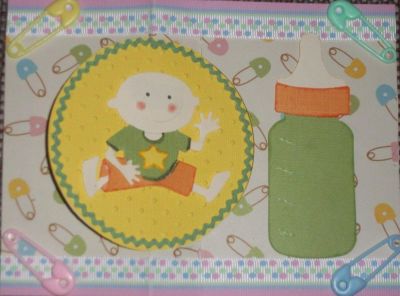 Baby card inside
The inside circle was cut using yellow paper, then trimmed with small green rickrack. The baby is a Sizziltz cut out of cream, green and orange. The star is from another Sizzlit.  The baby bottle is from a medium sized (yellow) die,cut out of cram, green, and orange paper. 
Keywords: Circle Flip It die sizzlit