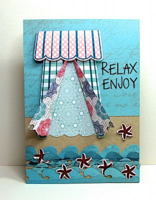 Cabana Club
 I pictured a scene on a faraway beach with blue waters, warm sun, rolling waves and a cabana to enjoy the scenery from.

The popcorn box from popcorn2stamp was used up-side-down to create the cabana and it's canopy.  Waves and starfish were die cut from flipflop2stamp's dies.
