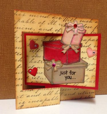 *Packages of Love*   Flip it's Card
This card was fun to created! I used distress ink, gellatos, gems, heart punch, rectangle flip it's die, package & bows die, Sakura glitter pen, and S.U river rock marker.
