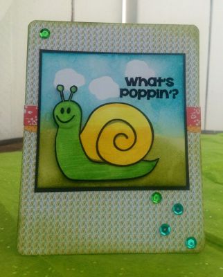 What's Popping Little Snail?
The clouds are the popping popcorn.... I color the snail with comics markers. The background  is white card stock I distress it with blue and green distress ink. I cover the clouds with sticky post, them I used the distress ink. Sprinkle some drops of water. 
