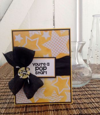 You are a POP star!
I Clear emboss the stars, distress ink around with T.H (wild honey). White, yellow, black card-stock.
