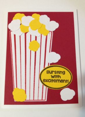 Placed on red paper with die cut popcorn and bag
