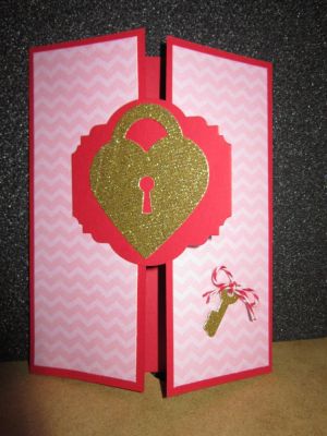 Gatefold card made with design paper and red/white twine from the Card Kit Club kit and Locket and key die from the matching die set for heartlocket2love.
