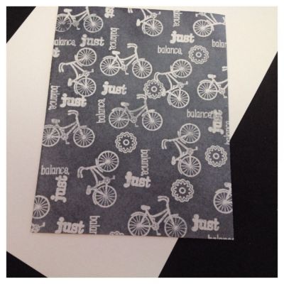 Making more patterned paper with TSOL stamps.  Started off with the light gray paper shown in the back, stamped w/versamark ink, clear embossed, sponged TimHoltz black soot & ironed off the embossing.
