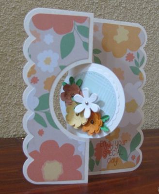mini flower dies on circle flip it card (front)
loving the mini flower dies.  I cut some flowers in green, too, then snipped the petals with scissors to create leaves for the flowers.  
